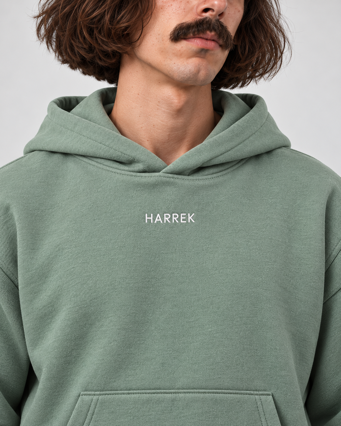 Green oversized hoodie with HARREK logo